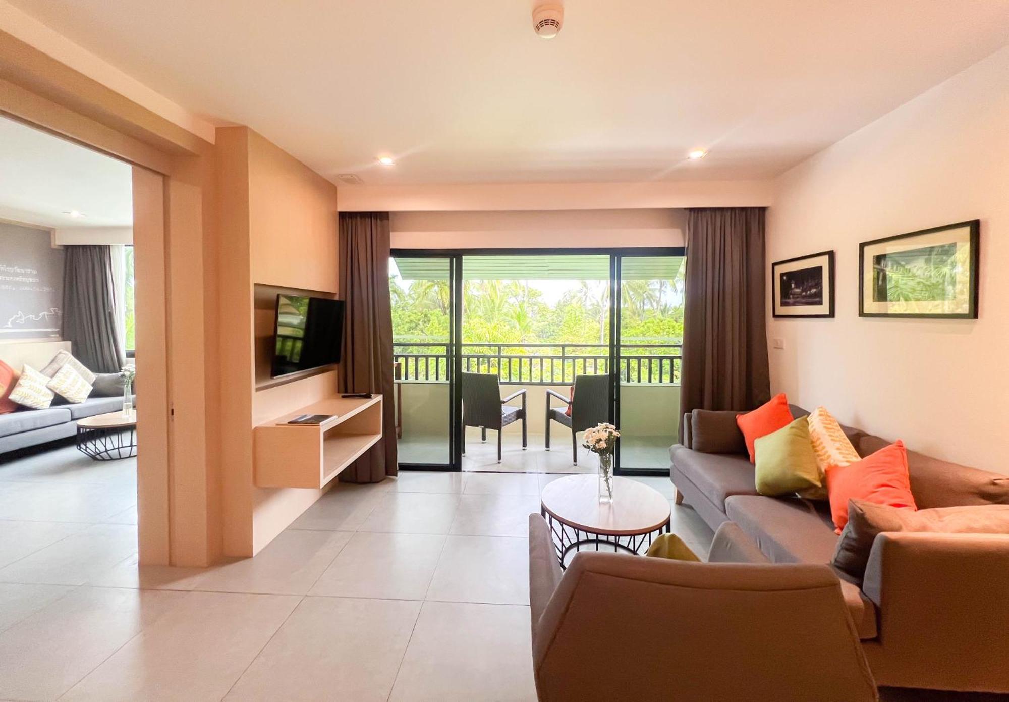 Paradox Resort Phuket Karon Esterno foto Living room of a suite at the Royal Paradise Hotel & Spa